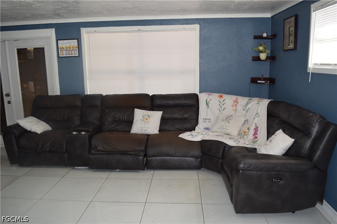 17 Colorado Road Lehigh Acres, FL 33936 - Photo 3 of 17 a living room with furniture and a window