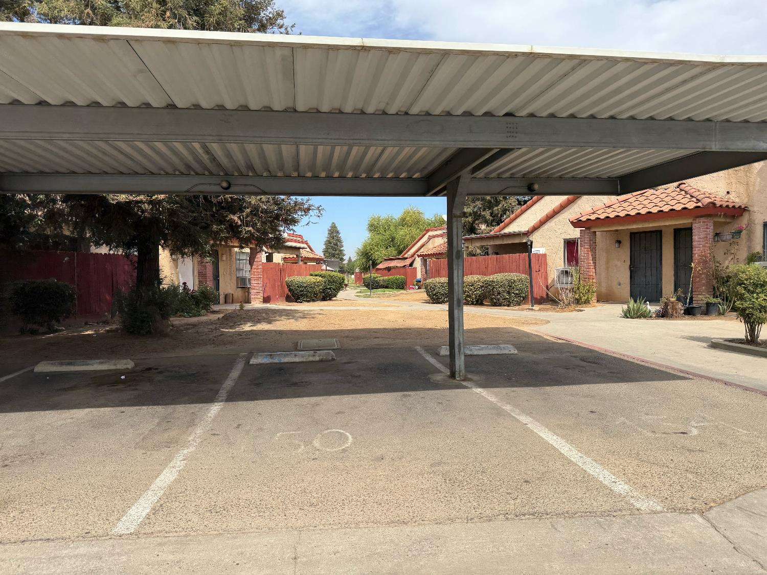 1405 East Cypress Avenue, Unit 137 Reedley, CA 93654 - Photo 2 of 15 a view of a patio with a table and chairs