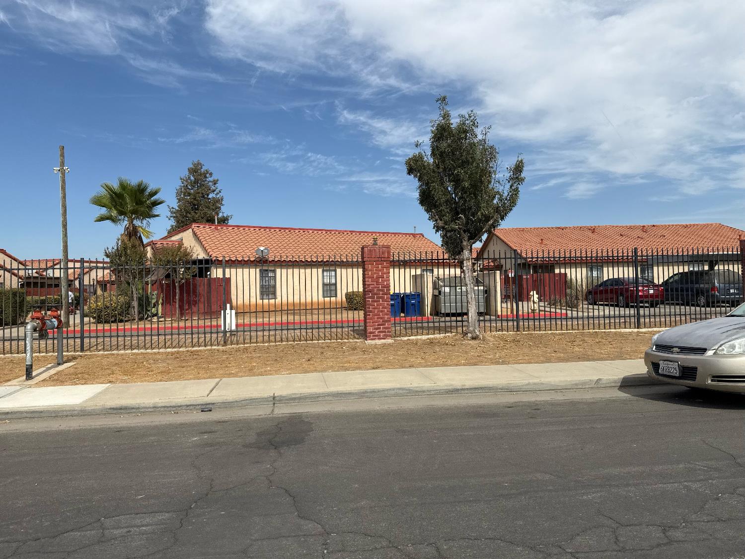 1405 East Cypress Avenue, Unit 137 Reedley, CA 93654 - Photo 3 of 15 a view of a swimming pool with a yard in front of it