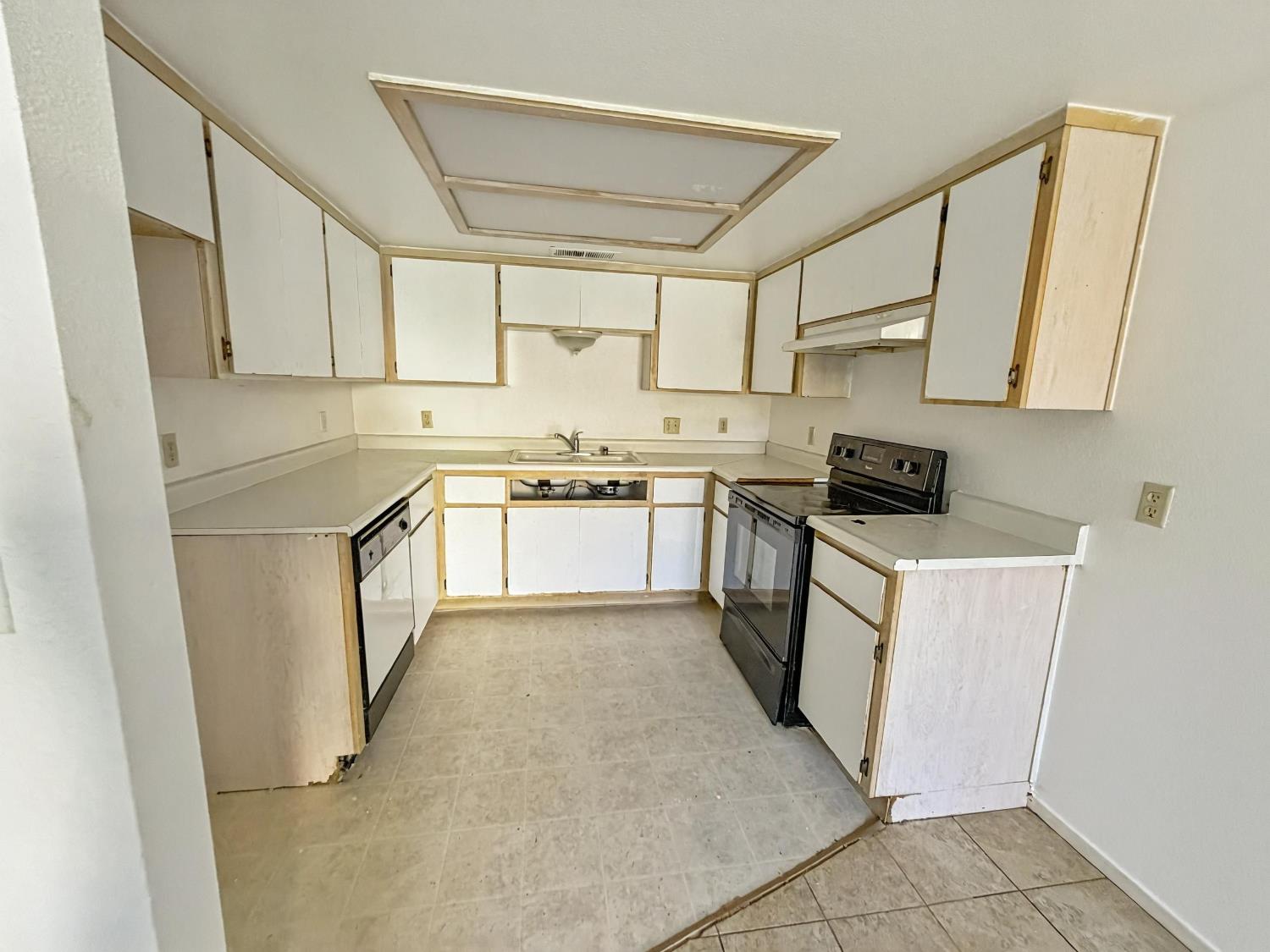 1405 East Cypress Avenue, Unit 137 Reedley, CA 93654 - Photo 8 of 15 a kitchen with white cabinets stainless steel appliances