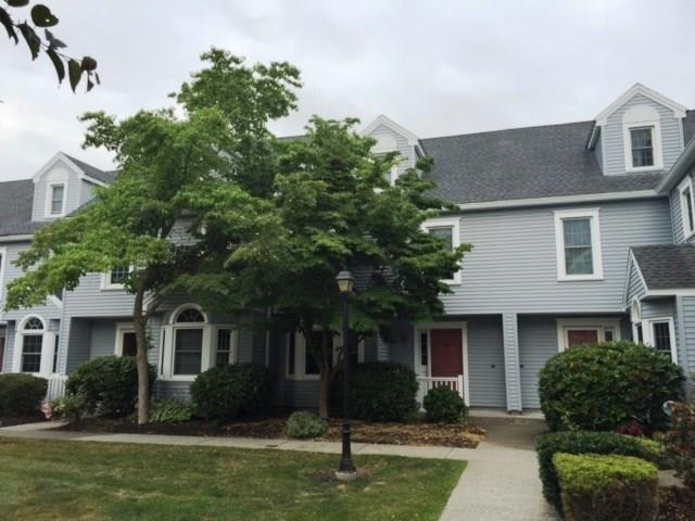 378 Meridian Street Extension, Unit 28 Groton, CT 06340 - Photo 1 of 1 a front view of a house with a garden