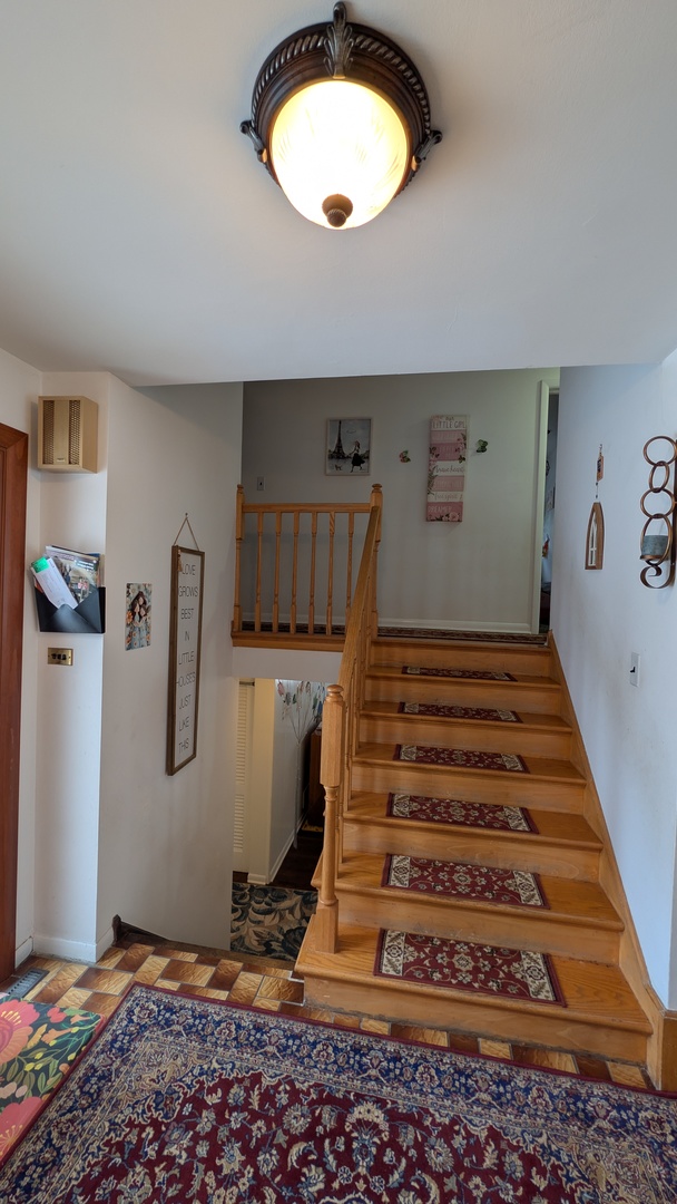 232 Kilpatrick Avenue Wilmette, IL 60091 - Photo 12 of 41 a view of a livingroom with a staircase