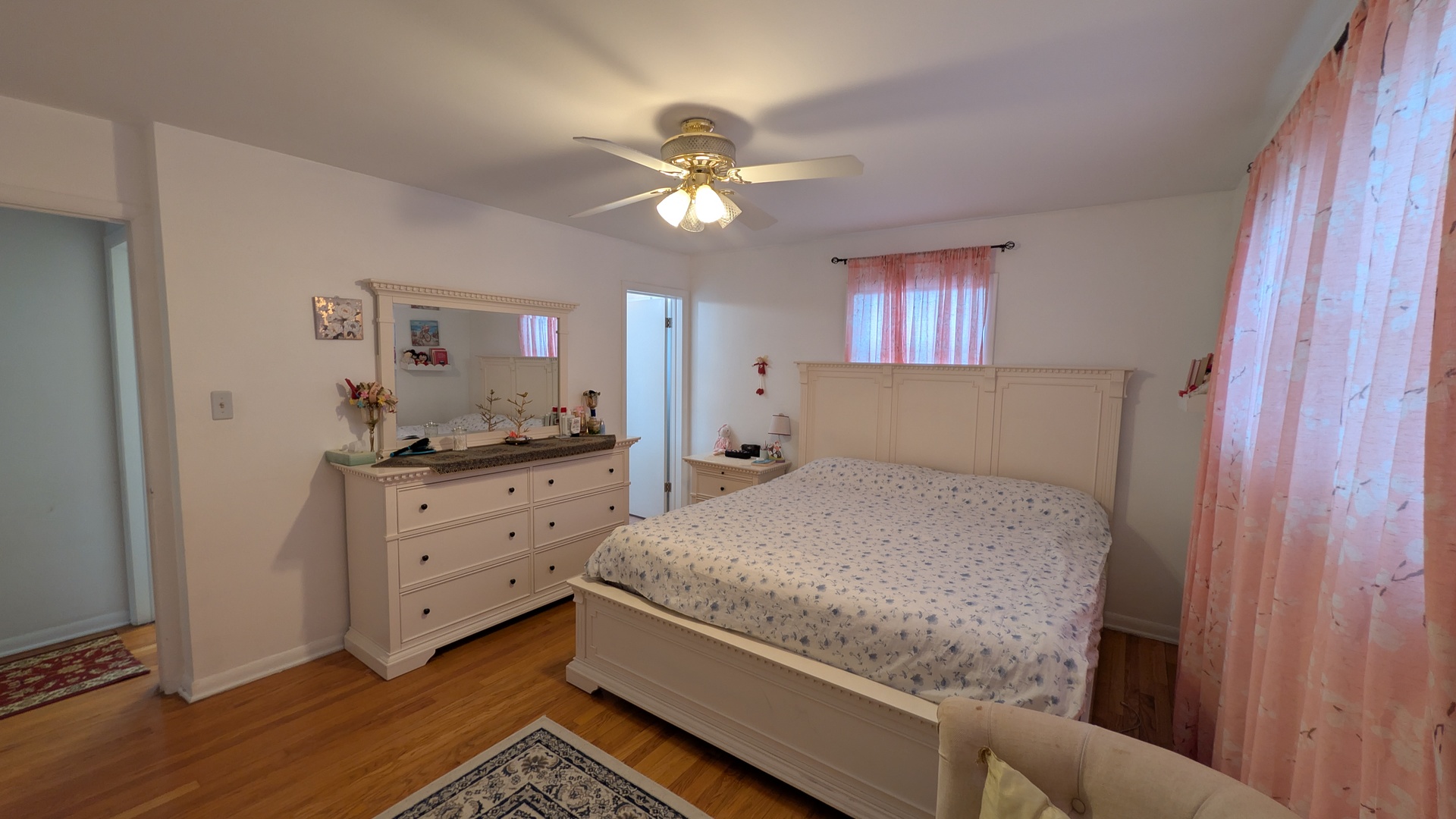 232 Kilpatrick Avenue Wilmette, IL 60091 - Photo 13 of 41 a bedroom with a bed and a chandelier