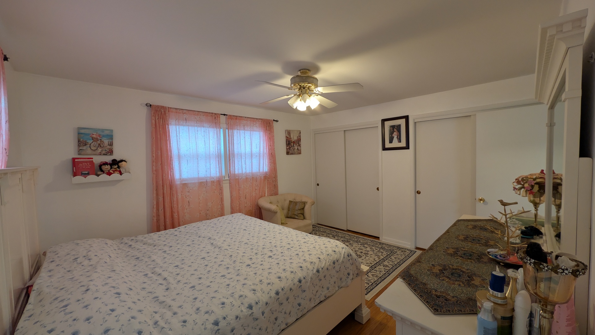 232 Kilpatrick Avenue Wilmette, IL 60091 - Photo 14 of 41 a bedroom with a bed and a chandelier