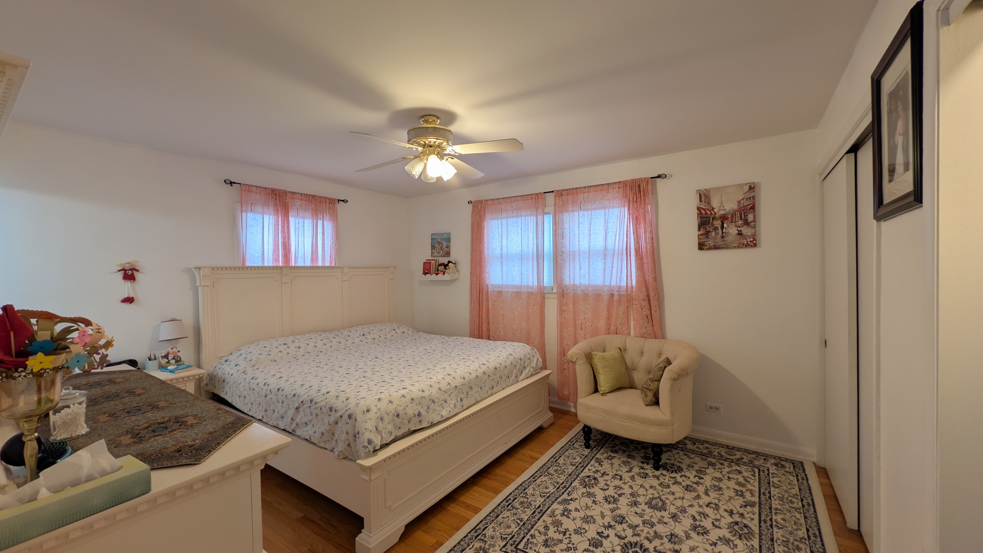 232 Kilpatrick Avenue Wilmette, IL 60091 - Photo 15 of 41 a bedroom with a bed and a chandelier