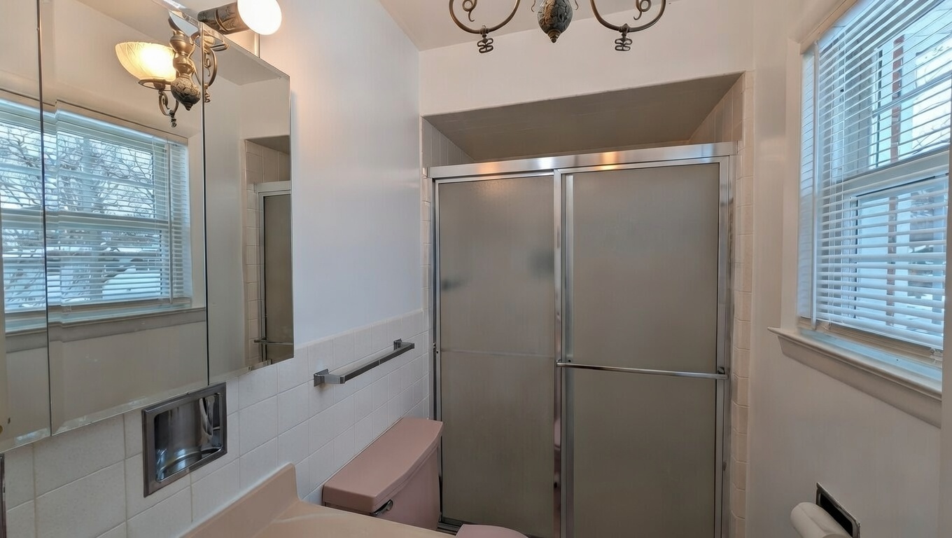 232 Kilpatrick Avenue Wilmette, IL 60091 - Photo 16 of 41 a bathroom with a bathtub and a shower
