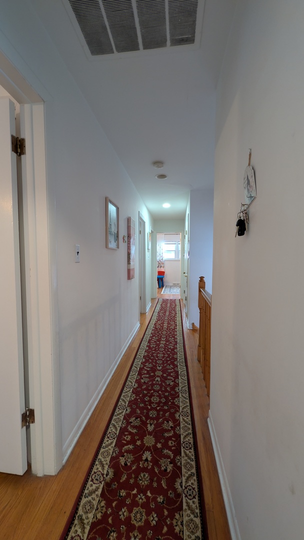 232 Kilpatrick Avenue Wilmette, IL 60091 - Photo 17 of 41 a view of a hallway view with staircase
