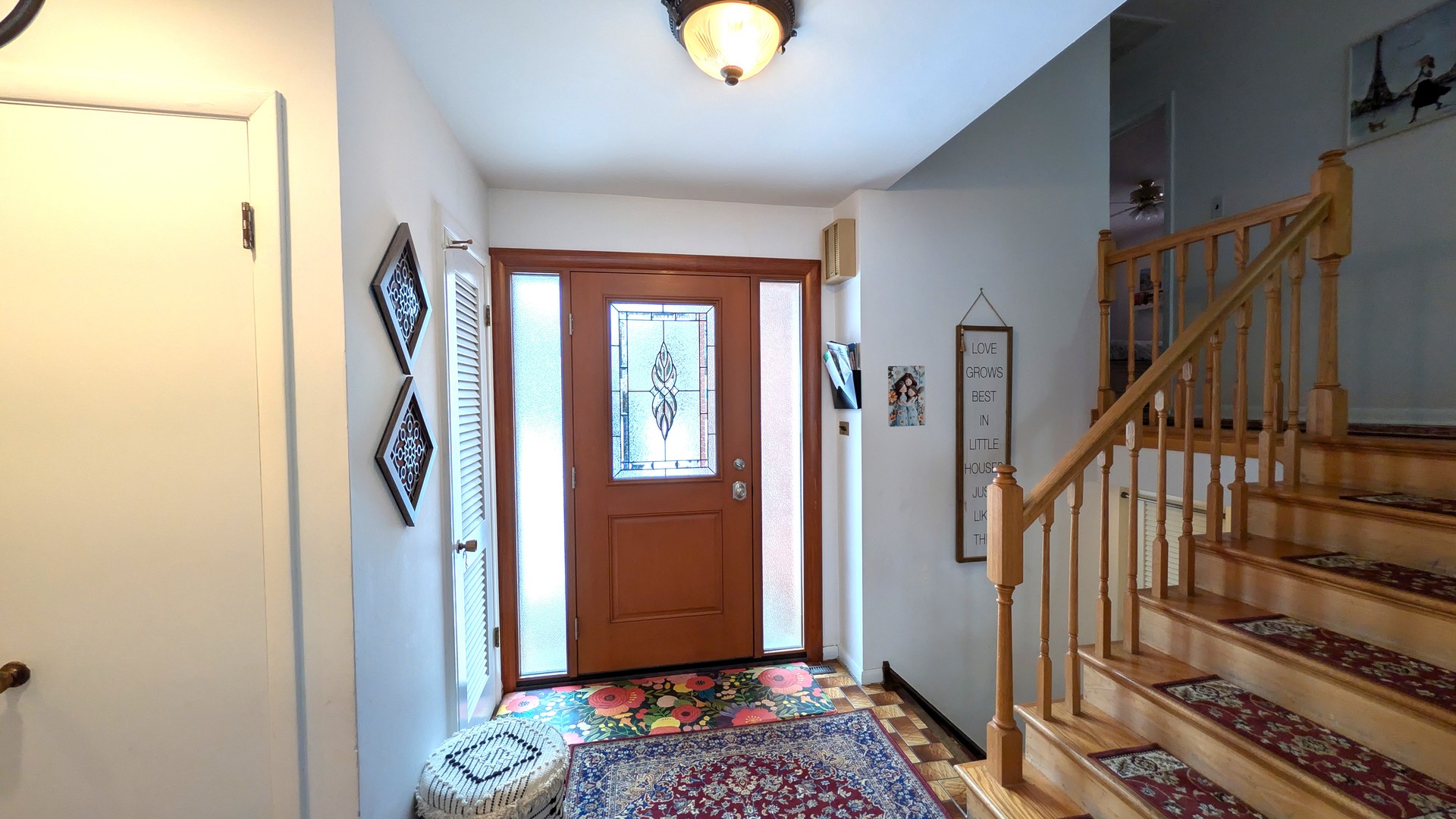232 Kilpatrick Avenue Wilmette, IL 60091 - Photo 2 of 41 a view of entryway with wooden floor and stairs