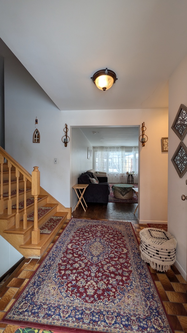 232 Kilpatrick Avenue Wilmette, IL 60091 - Photo 3 of 41 a bed room with furniture and a rug
