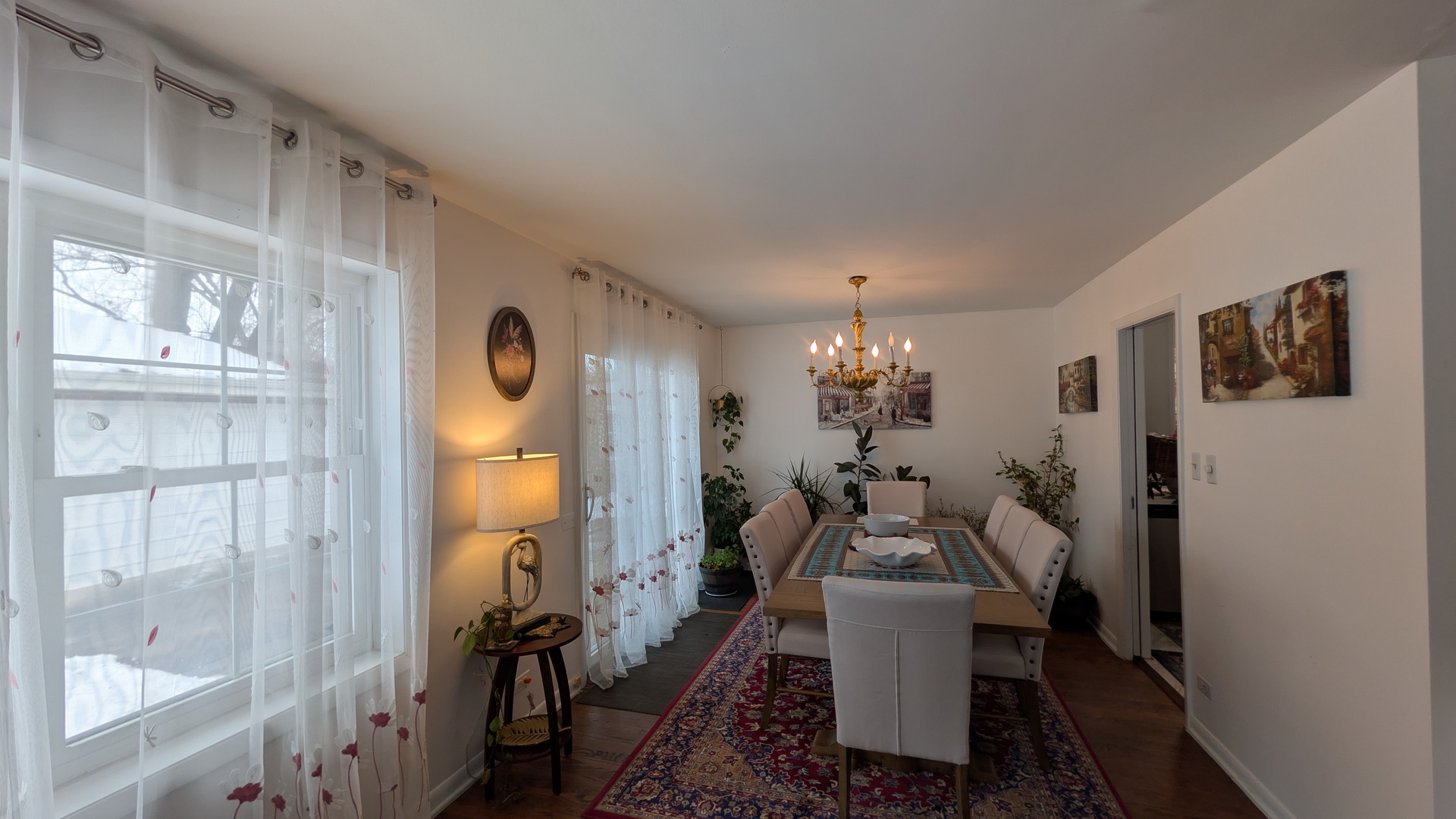 232 Kilpatrick Avenue Wilmette, IL 60091 - Photo 9 of 41 a dining room with furniture a chandelier and wooden floor