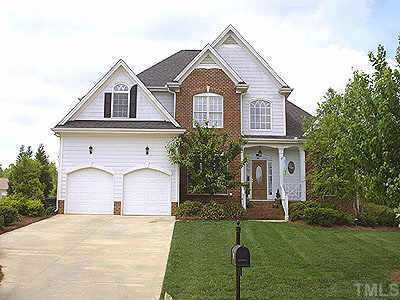 301 Challenge Raleigh, NC 27603 - Photo 1 of 1 a front view of a house with a yard and garage