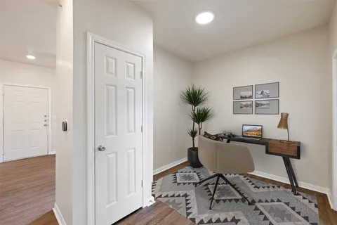 a workspace with furniture and wooden floor