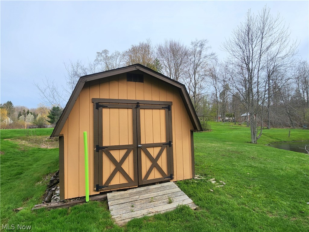8965 Cedar Road Chesterland, OH 44026 - Photo 45 of 50 20x10' Shed to the Right of the Pond Recently Painted and Emptied