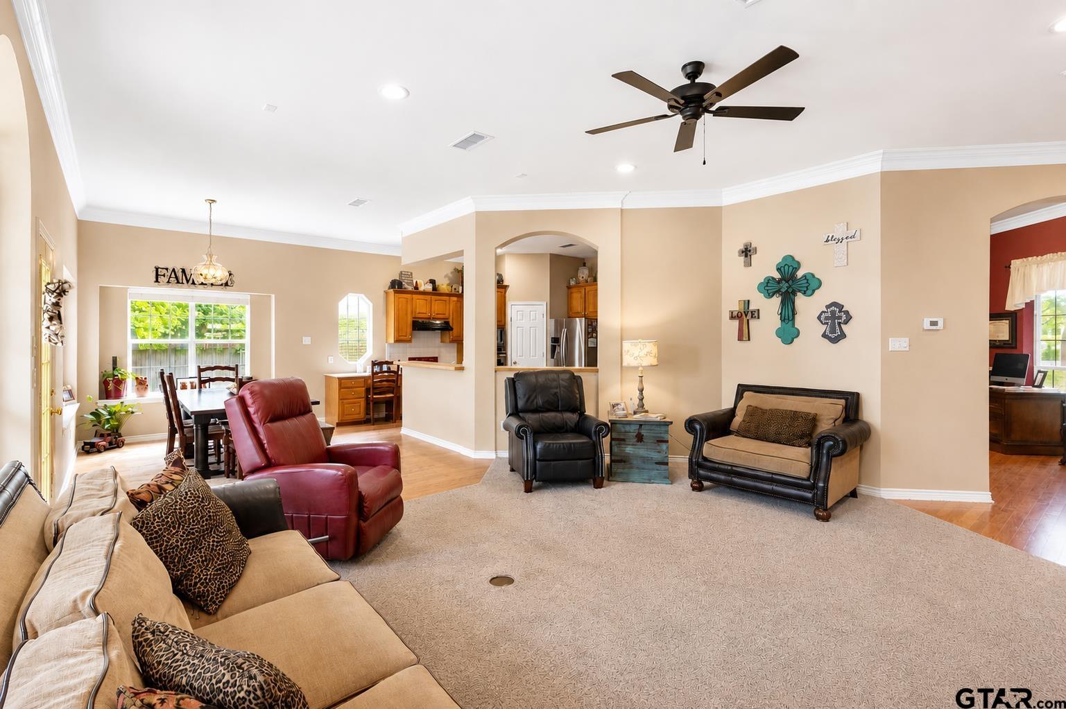 1388 Santa Fe Trail Tyler, TX 75703 - Photo 14 of 46 a living room with furniture ceiling fan and a wooden floor
