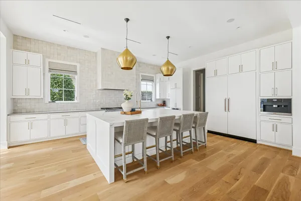 a kitchen with a sink cabinets and window