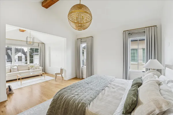 a bedroom with a bed and window