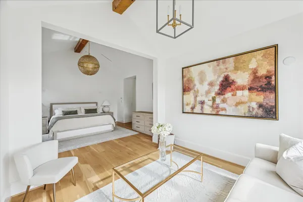 a living room with a couch and cabinets