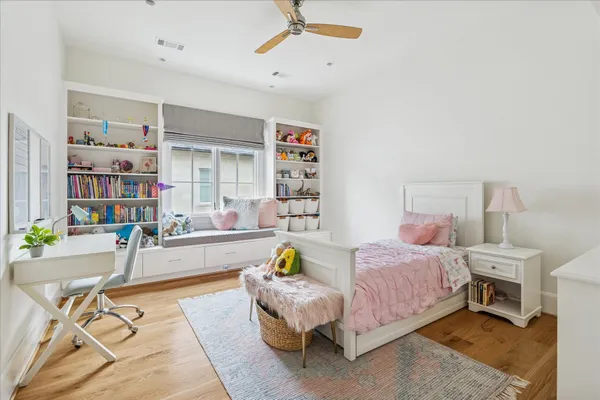 a bedroom with a bed and a couch