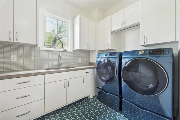a kitchen with a cabinets and a sink