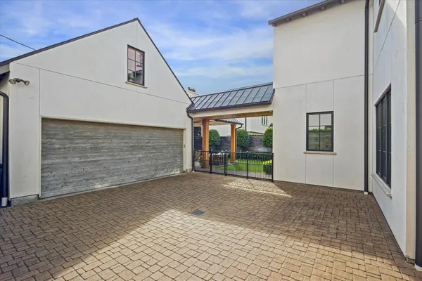 a view of a house with brick walls
