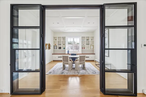 view of living room with a large window and dining table view