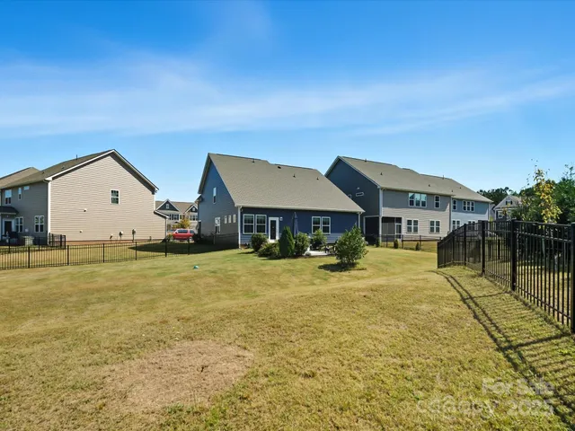 a front view of a house with yard