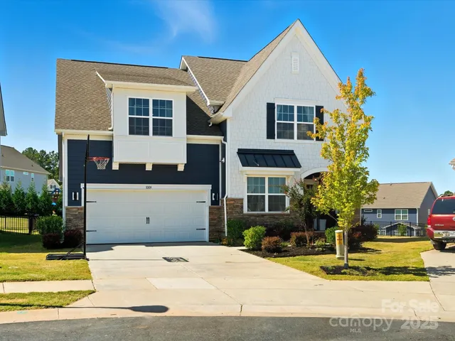 a front view of a house with small garden