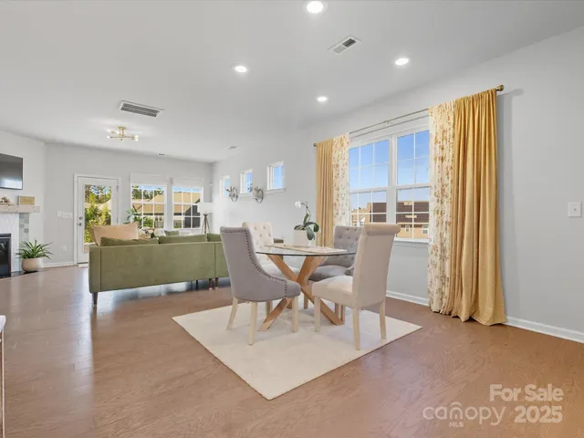 a view of a dining room with furniture and a window