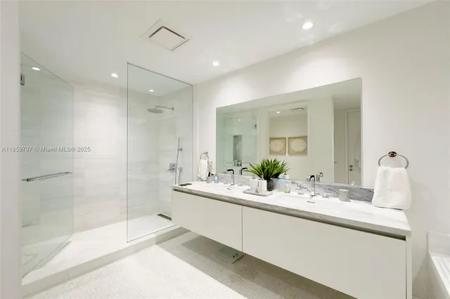 a bathroom with a bathtub and a sink