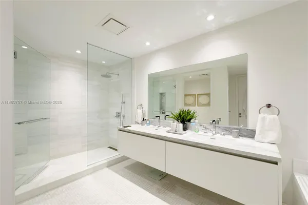 a bathroom with a bathtub and a sink