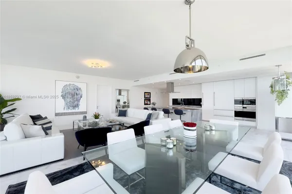 a living room with fireplace furniture and a wooden floor