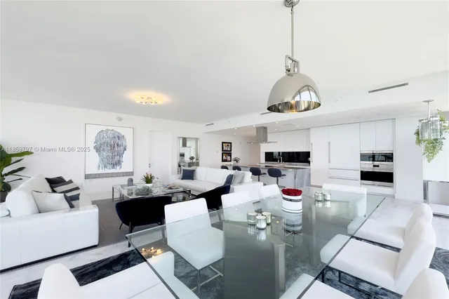 a living room with fireplace furniture and a wooden floor