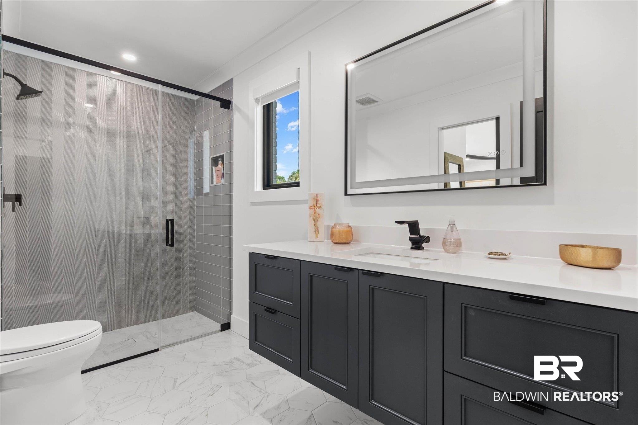 69 Jordan Lane Mobile, AL 36608 - Photo 29 of 57 Full bath with vanity, a shower stall, and light marble finish floors