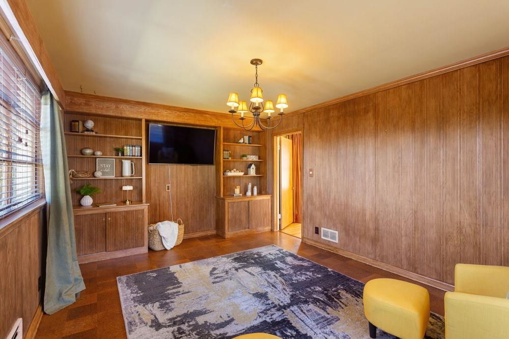 210 Edgewood Road Staunton, VA 24401 - Photo 11 of 41 a bedroom with a bed and a chandelier