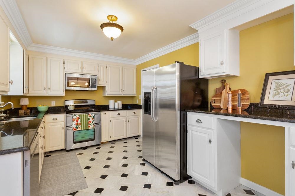 210 Edgewood Road Staunton, VA 24401 - Photo 13 of 41 a kitchen with stainless steel appliances a refrigerator sink and microwave
