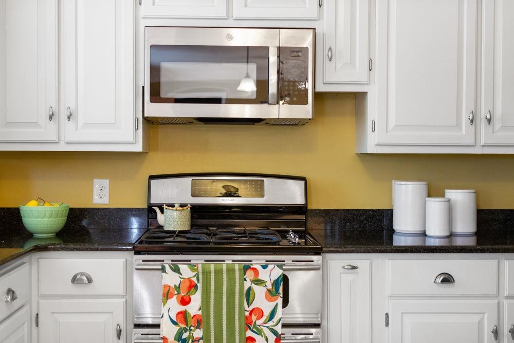 210 Edgewood Road Staunton, VA 24401 - Photo 18 of 41 a kitchen with stainless steel appliances granite countertop a stove and a microwave