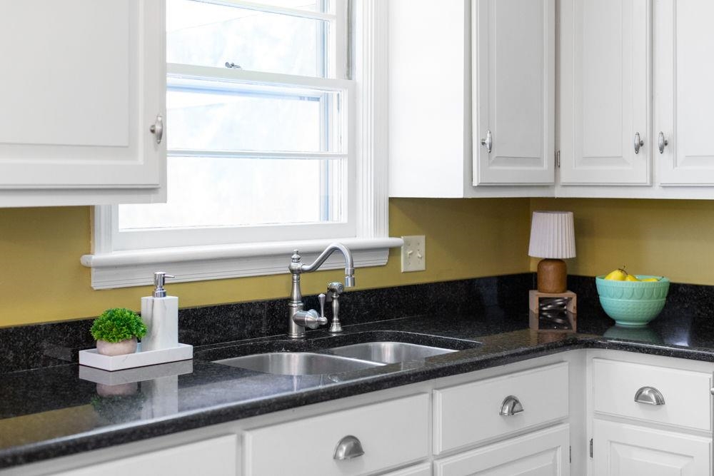 210 Edgewood Road Staunton, VA 24401 - Photo 19 of 41 a kitchen with a sink and potted plant