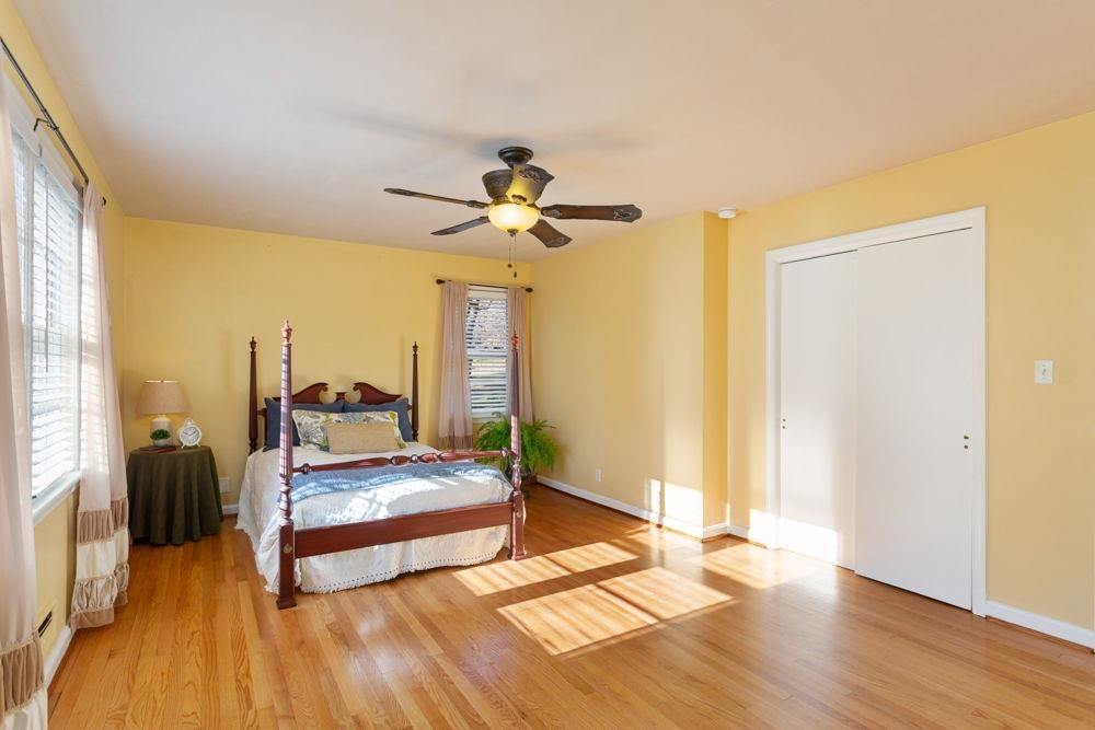 210 Edgewood Road Staunton, VA 24401 - Photo 22 of 41 a living room with a bed furniture and a ceiling fan