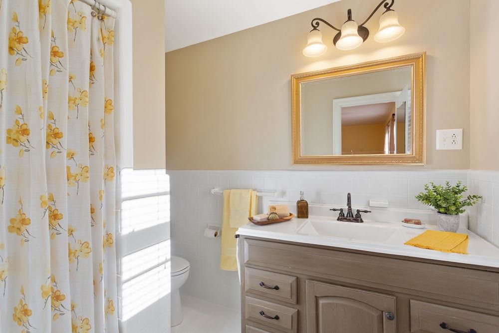 210 Edgewood Road Staunton, VA 24401 - Photo 25 of 41 a bathroom with a sink a mirror and a shower curtain