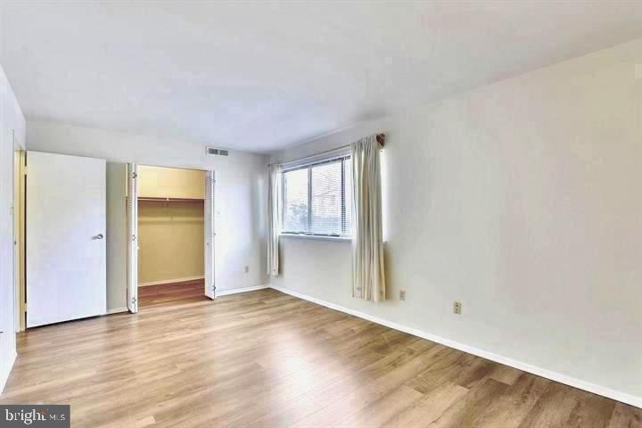 2044 Royal Fern Court, Unit 19/2A Reston, VA 20191 - Photo 6 of 17 Light-filled bedroom with walk-in closet