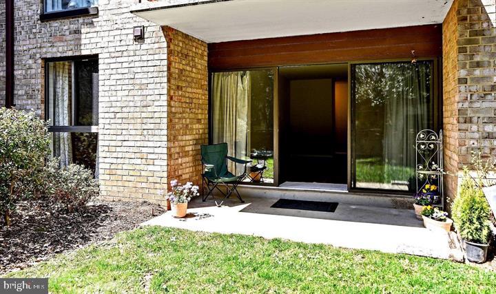 2044 Royal Fern Court, Unit 19/2A Reston, VA 20191 - Photo 8 of 17 Living Room opens onto a charming patio
