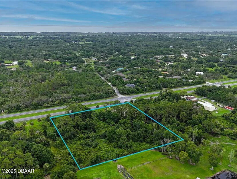4150 U.S. Rte 1 Mims, FL 32754 - Photo 2 of 6 a view of a city with lush green forest