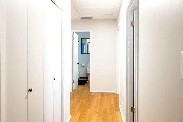 a bathroom with a shower and a glass door