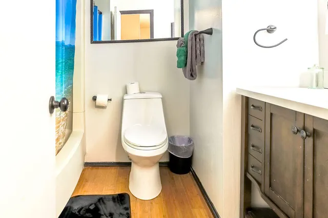 a view of a hallway with a window and a chandelier