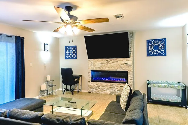 a bedroom with a bed and a couch