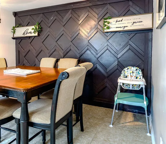 a bedroom with a bed and a floor to ceiling window