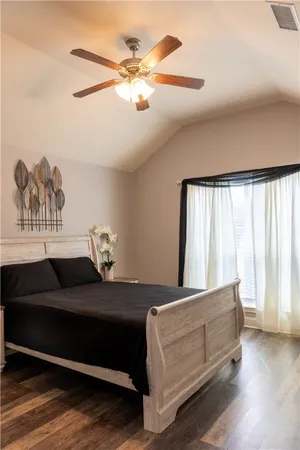 a bedroom with bed and window