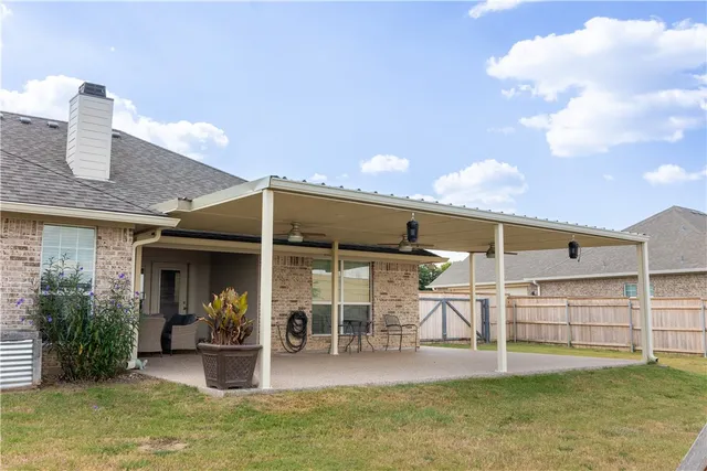 outdoor view of a house with porch and sitting area