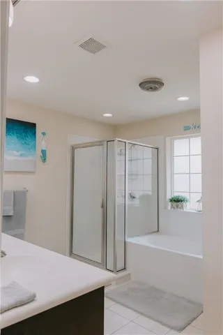 a bathroom with a bathtub and a sink