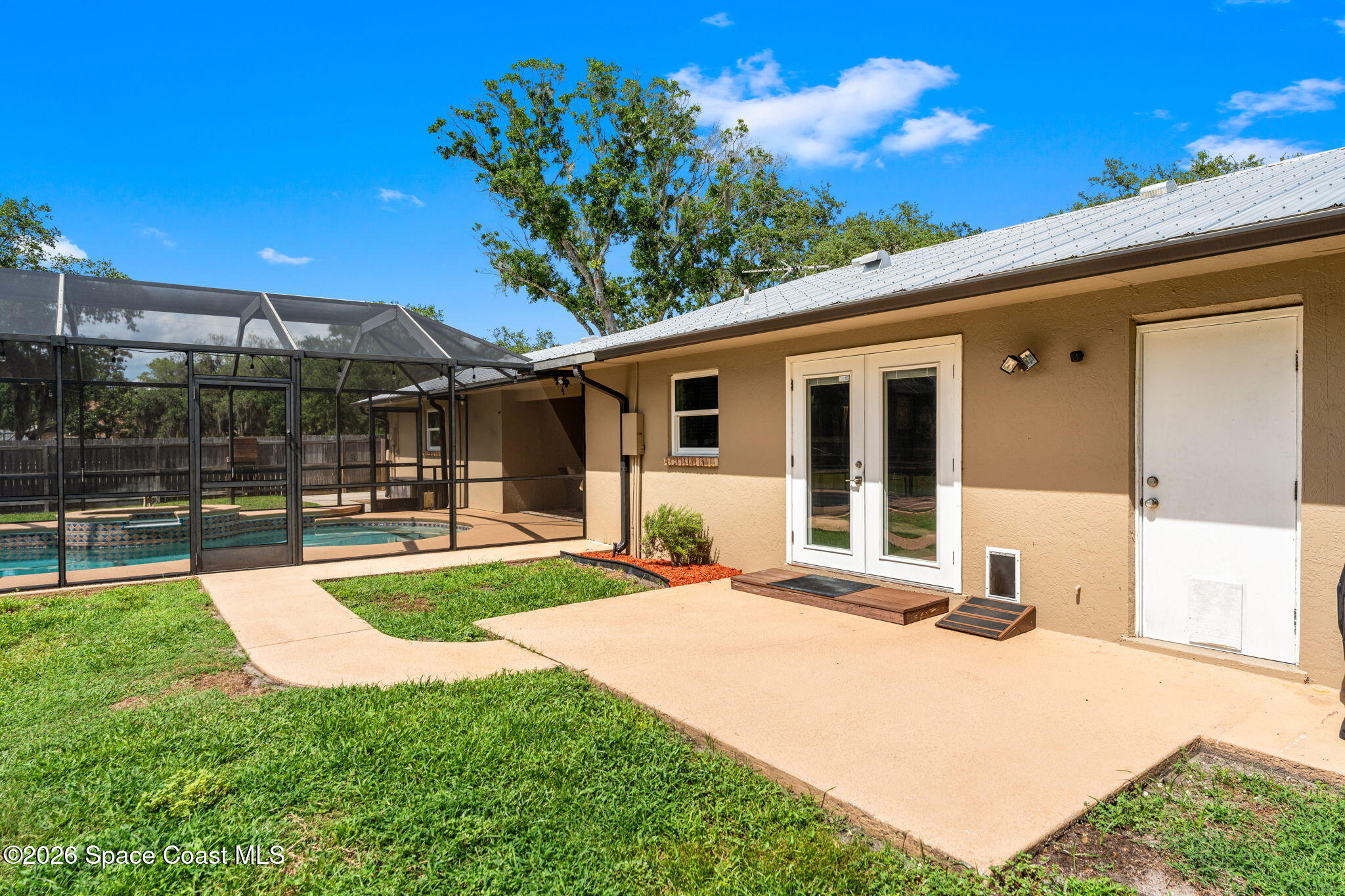 3480 Turtle Mound Road Melbourne, FL 32934 - Photo 45 of 69 backyard entry from dining